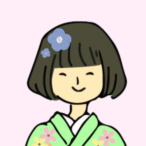 大平陽香（おはる）さんの似顔絵イラスト。緑の花柄の着物を着て、髪に青い花飾りをつけ、にっこり笑っている。
